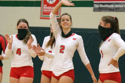 Senior Natalie Kimmel waves as they introduce her at the first home game of the season.